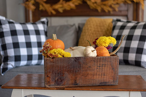 A fall seasonal display on living room table