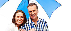 A couple protected under an umbrella