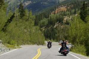 Two motorcyclist riding on winding mountain road