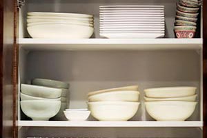 Cabinet filled with dishes and bowls