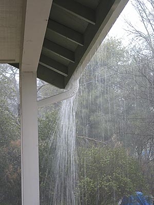 An overflowing rain gutter